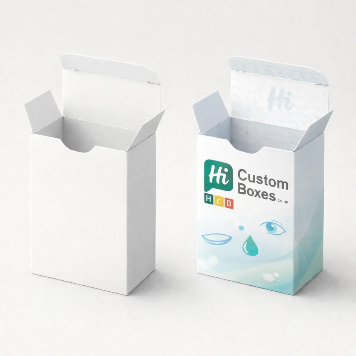 Two upright tuck-end cartons with thumb notches- one plain white and one with a branded blue design- class=